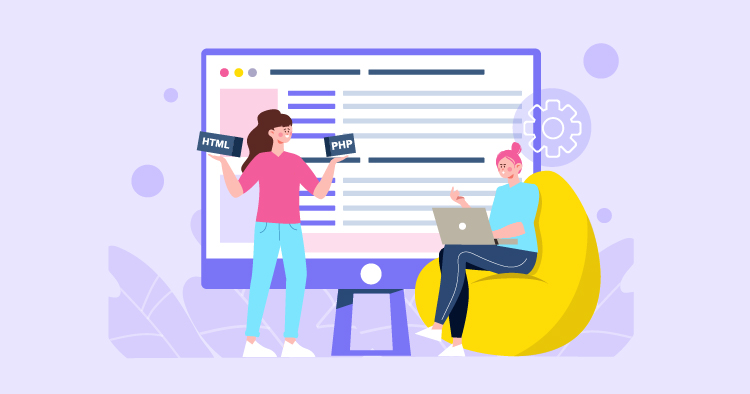 Two women collaborating on web development, one holding coding signs and the other working on a laptop in a cozy setting, with a large computer screen displaying a website layout in the background.