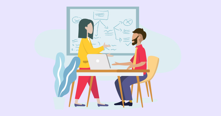 Two professionals engaged in a collaborative discussion at a desk with a laptop, surrounded by a whiteboard displaying diagrams and notes, representing teamwork and brainstorming in a modern office setting.