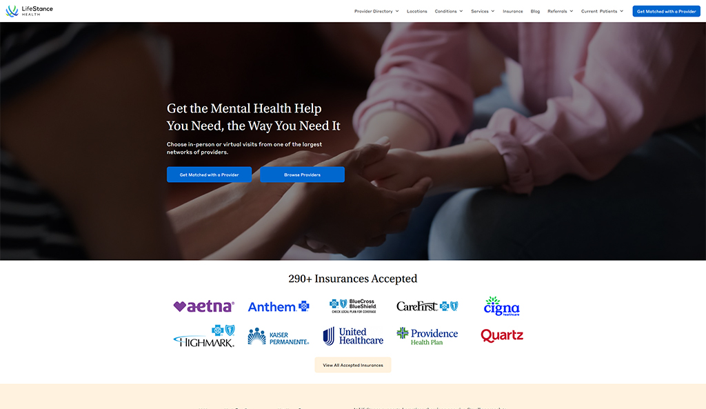 Hands of two individuals gently clasped together, symbolizing support and connection in mental health care. The background features the LifeStance Health website, highlighting options for in-person and virtual visits with a wide network of providers. Logos of various accepted insurance providers are displayed below, emphasizing accessibility to mental health services.